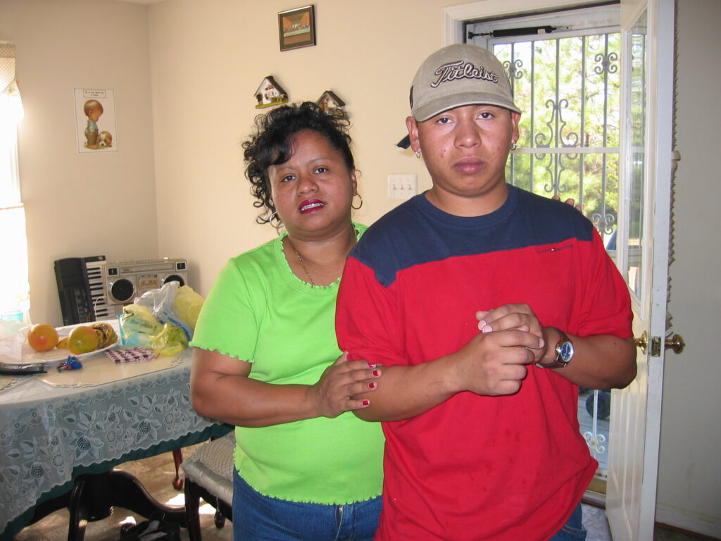 Enrique and Lourdes in their home in North Carolina, 2003.[Credit: Sonia Nazario]